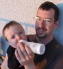 Tim feeding Eddie early in the morning on the balcony